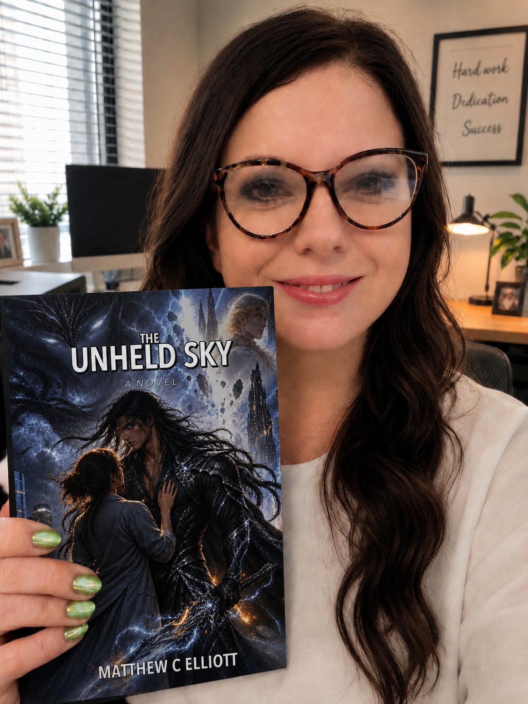 Reader holding a copy of The Unheld Sky